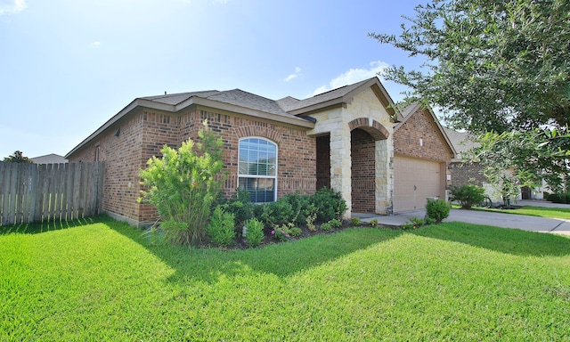 21015 Echo Manor Dr, Hockley, TX 77447 - french provincial home with brick siding, driveway, a garage, and stone siding