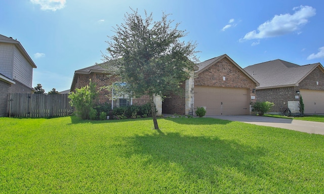 21015 Echo Manor Dr, Hockley, TX 77447 - view of front facade with brick siding, driveway, and an attached garage