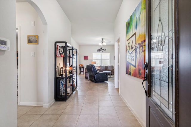 21015 Echo Manor Dr, Hockley, TX 77447 - entrance foyer featuring arched walkways, light tile patterned floors, and ceiling fan