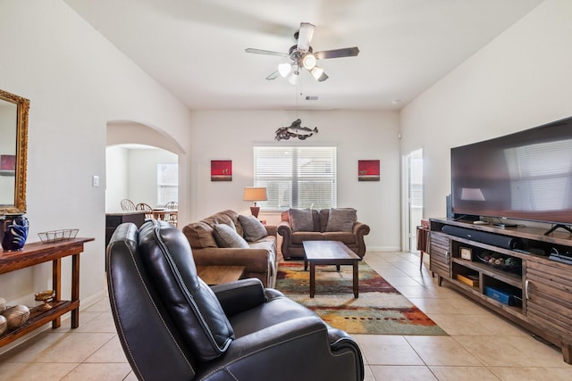 21015 Echo Manor Dr, Hockley, TX 77447 - living area with arched walkways, light tile patterned floors, and ceiling fan