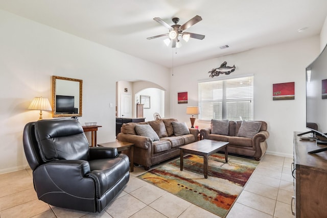 21015 Echo Manor Dr, Hockley, TX 77447 - living room featuring arched walkways, light tile patterned flooring, and ceiling fan