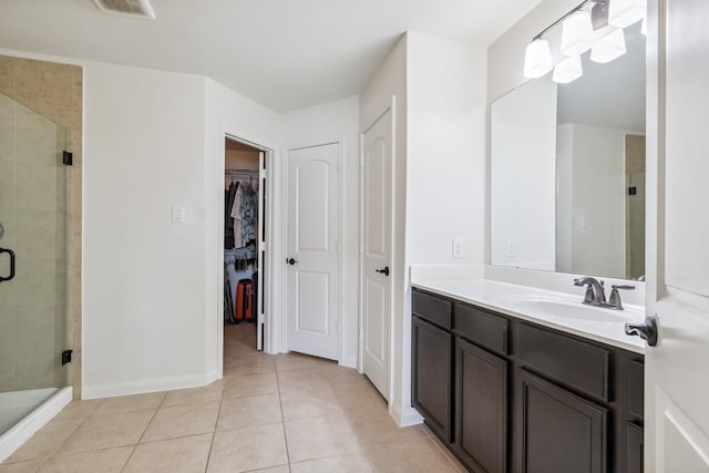 21015 Echo Manor Dr, Hockley, TX 77447 - full bath with vanity, tile patterned flooring, a stall shower, and a spacious closet