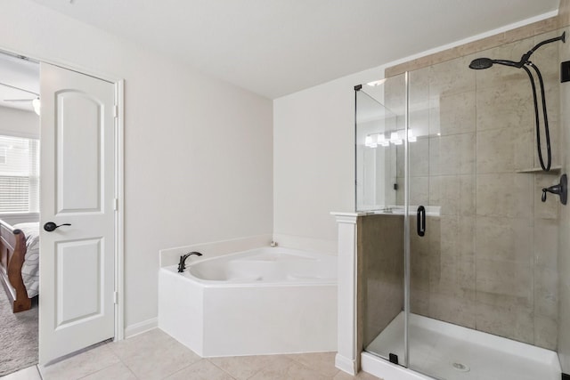 21015 Echo Manor Dr, Hockley, TX 77447 - ensuite bathroom featuring a garden tub, a stall shower, and tile patterned floors