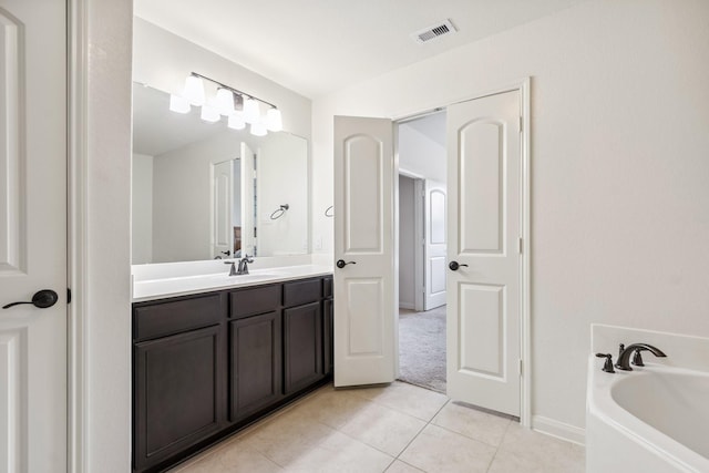 21015 Echo Manor Dr, Hockley, TX 77447 - full bathroom with a garden tub, vanity, and tile patterned floors