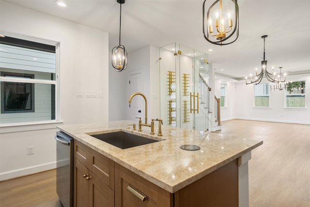 882 Prosper St, Houston, TX 77088 - kitchen with a chandelier, dishwasher, light wood finished floors, open floor plan, and an island with sink
