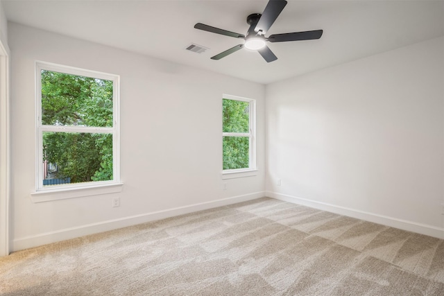 882 Prosper St, Houston, TX 77088 - empty room with light colored carpet, plenty of natural light, and ceiling fan