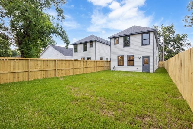 882 Prosper St, Houston, TX 77088 - back of house featuring a fenced backyard and a shingled roof