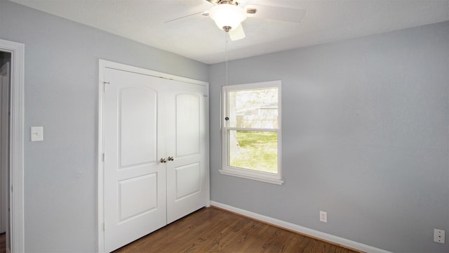 8106 Montridge Dr, Houston, TX 77055 - unfurnished bedroom with a closet, dark wood finished floors, and ceiling fan