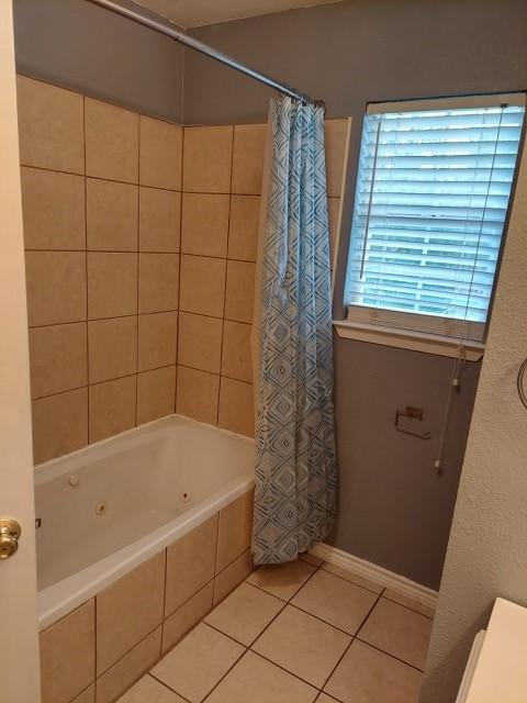 380 Rae Ann Blvd, Livingston, TX 77351 - full bath with tile patterned flooring and a combined bath / shower with jetted tub