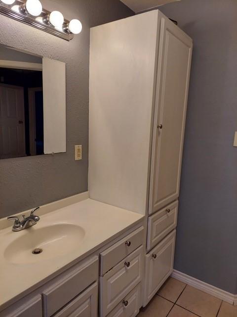380 Rae Ann Blvd, Livingston, TX 77351 - bathroom with vanity and tile patterned floors