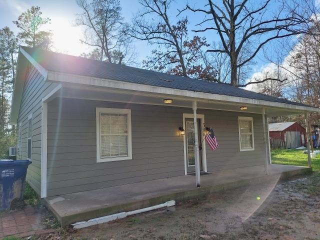 380 Rae Ann Blvd, Livingston, TX 77351 - view of front facade featuring covered porch