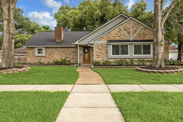 16217 Singapore Ln, Jersey Village, TX 77040 - view of front facade featuring brick siding, a chimney, and roof with shingles