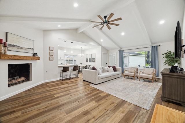16217 Singapore Ln, Jersey Village, TX 77040 - living area with wood finished floors, a ceiling fan, healthy amount of natural light, a fireplace, and recessed lighting