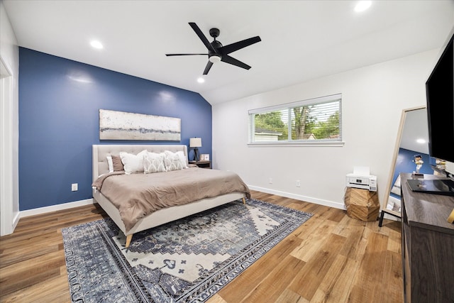 16217 Singapore Ln, Jersey Village, TX 77040 - bedroom with wood finished floors, ceiling fan, lofted ceiling, and recessed lighting