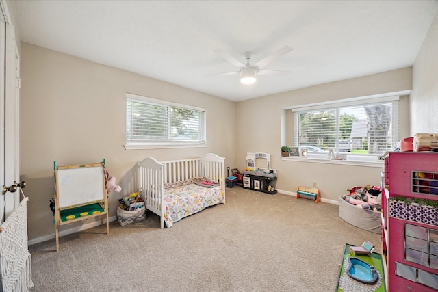 16217 Singapore Ln, Jersey Village, TX 77040 - bedroom with carpet flooring, a nursery area, and a ceiling fan