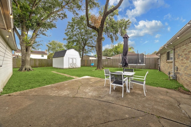 16217 Singapore Ln, Jersey Village, TX 77040 - fenced backyard with a trampoline, a patio area, a shed, and outdoor dining area