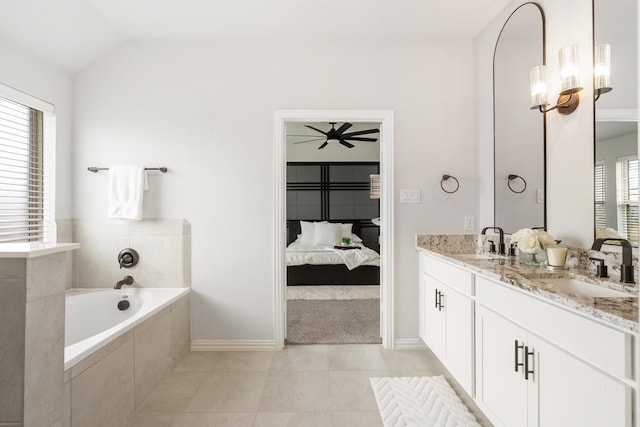 4118 Palmer Meadow Ct, Katy, TX 77494 - ensuite bathroom with double vanity, a bath, tile patterned floors, ceiling fan, and lofted ceiling
