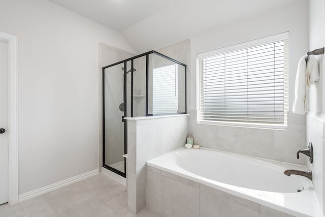 4118 Palmer Meadow Ct, Katy, TX 77494 - bathroom with a bath, a shower stall, vaulted ceiling, and tile patterned flooring