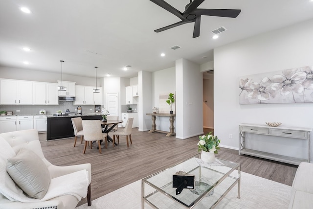 4118 Palmer Meadow Ct, Katy, TX 77494 - living room with ceiling fan, light wood-type flooring, and recessed lighting