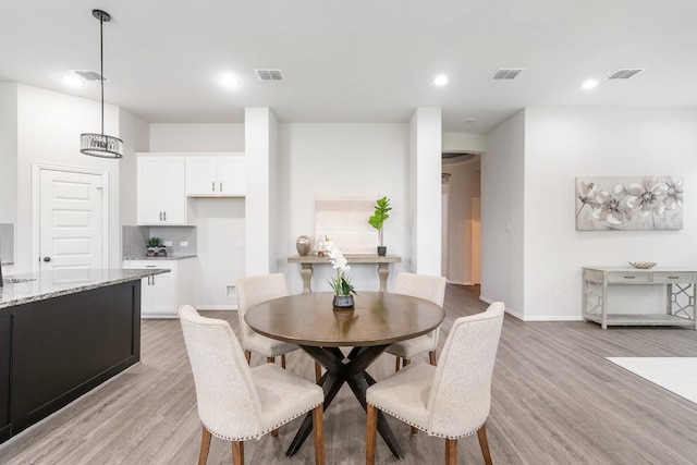 4118 Palmer Meadow Ct, Katy, TX 77494 - dining area with light wood-style flooring and recessed lighting