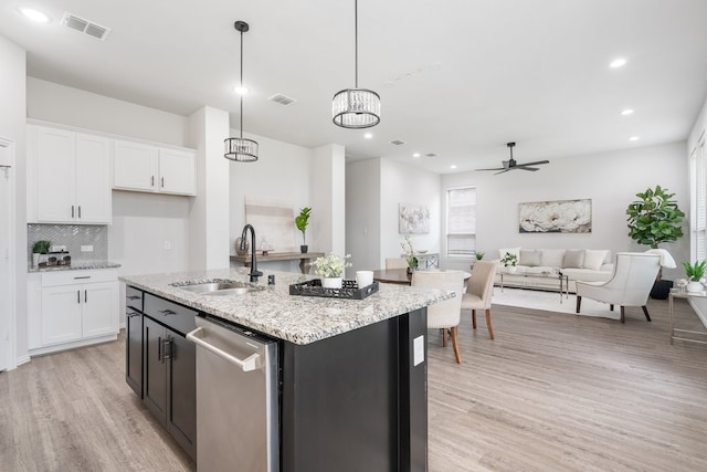4118 Palmer Meadow Ct, Katy, TX 77494 - kitchen featuring stainless steel dishwasher, light wood-style floors, white cabinets, backsplash, and ceiling fan