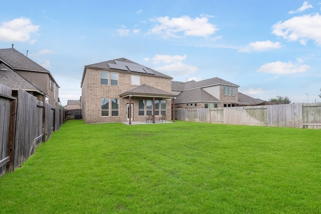4118 Palmer Meadow Ct, Katy, TX 77494 - rear view of property featuring a patio, a fenced backyard, solar panels, and brick siding
