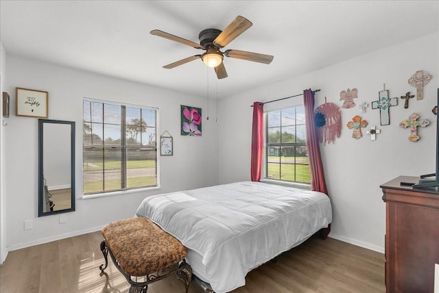 1312 22nd St N, Texas City, TX 77590 - bedroom featuring wood finished floors and ceiling fan