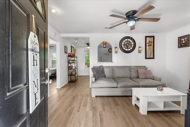 1312 22nd St N, Texas City, TX 77590 - living room featuring a ceiling fan and light wood-style floors