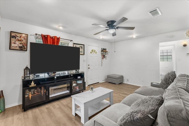 1312 22nd St N, Texas City, TX 77590 - living room with ceiling fan and light wood finished floors