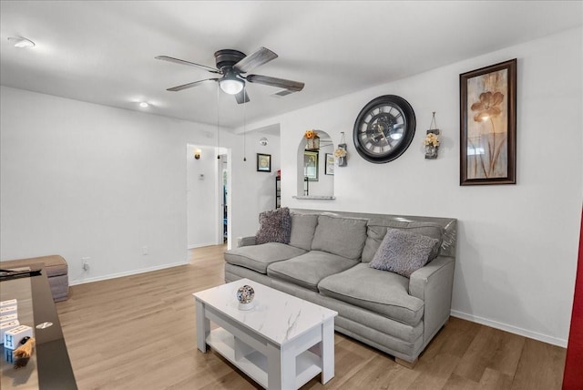 1312 22nd St N, Texas City, TX 77590 - living area featuring a ceiling fan and light wood-style floors