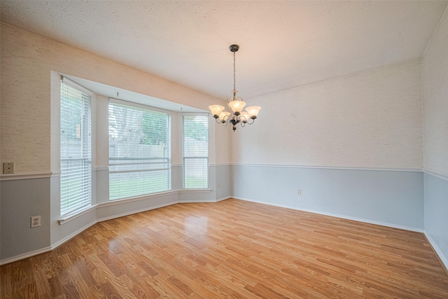 22522 Round Valley Dr, Katy, TX 77450 - spare room with a chandelier and wood finished floors