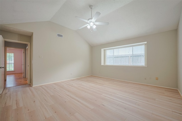 22522 Round Valley Dr, Katy, TX 77450 - unfurnished room with lofted ceiling, light wood-style floors, and ceiling fan
