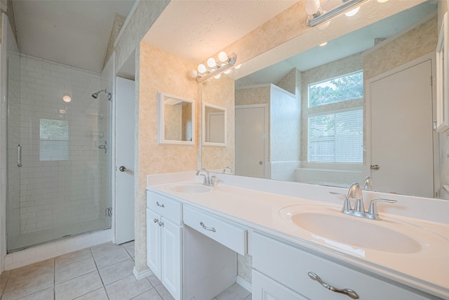 22522 Round Valley Dr, Katy, TX 77450 - bathroom with double vanity, a shower stall, and tile patterned floors
