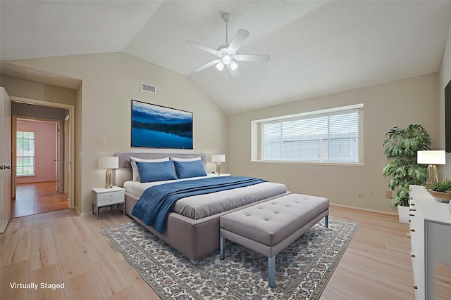 22522 Round Valley Dr, Katy, TX 77450 - bedroom featuring lofted ceiling, multiple windows, light wood finished floors, and ceiling fan