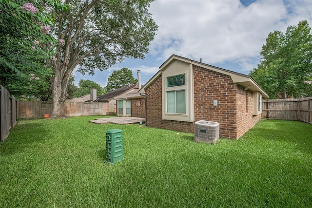 22522 Round Valley Dr, Katy, TX 77450 - rear view of house featuring brick siding and a fenced backyard