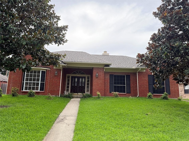 2147 Heather Green Dr, Houston, TX 77062 - single story home with a front lawn, french doors, a chimney, and roof with shingles