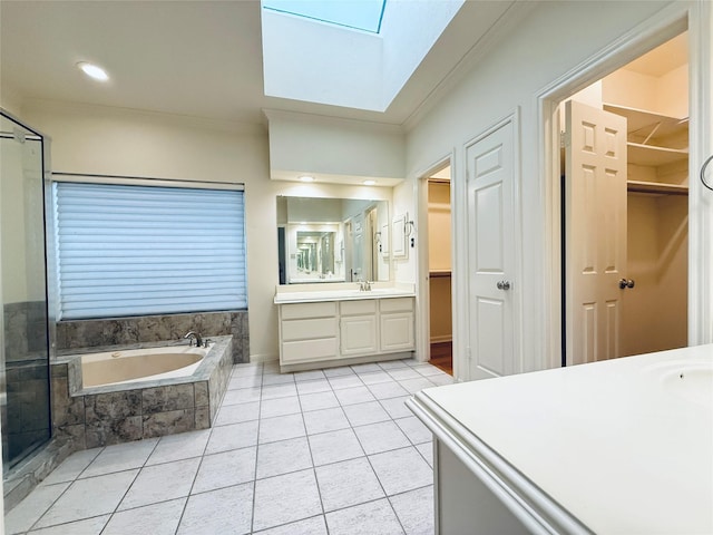 2147 Heather Green Dr, Houston, TX 77062 - full bath with a skylight, vanity, a bath, a spacious closet, and crown molding