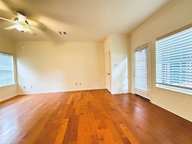 2147 Heather Green Dr, Houston, TX 77062 - empty room featuring crown molding, a ceiling fan, and wood finished floors