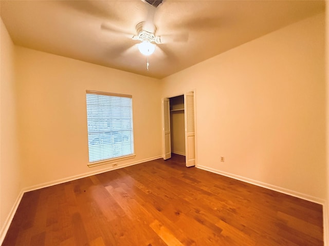 2147 Heather Green Dr, Houston, TX 77062 - unfurnished bedroom featuring dark wood-style flooring, a closet, and a ceiling fan