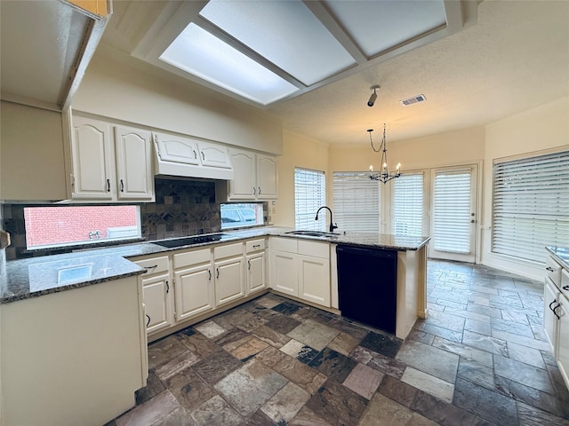 2147 Heather Green Dr, Houston, TX 77062 - kitchen with black appliances, a peninsula, white cabinets, and decorative backsplash