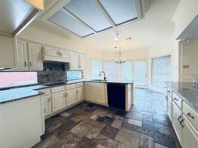 2147 Heather Green Dr, Houston, TX 77062 - kitchen with black appliances, a peninsula, stone tile flooring, decorative backsplash, and white cabinetry