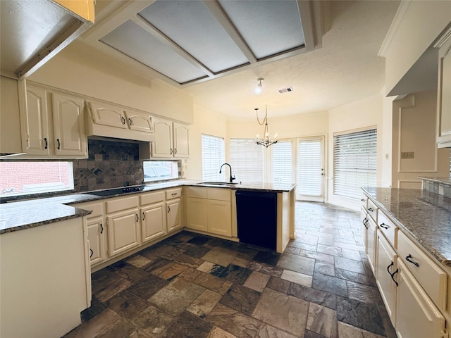 2147 Heather Green Dr, Houston, TX 77062 - kitchen with black appliances, stone tile flooring, a peninsula, backsplash, and stone counters