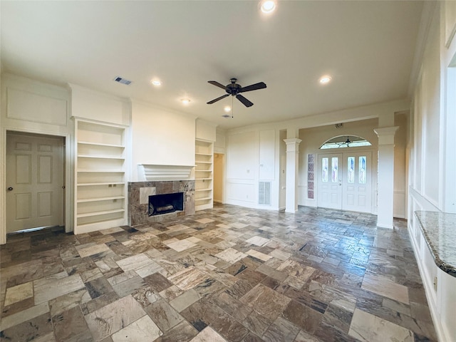 2147 Heather Green Dr, Houston, TX 77062 - unfurnished living room with ornate columns, ceiling fan, built in features, recessed lighting, and a fireplace