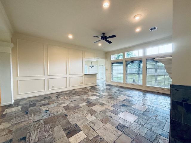 2147 Heather Green Dr, Houston, TX 77062 - unfurnished living room featuring a decorative wall, a ceiling fan, stone tile floors, and recessed lighting