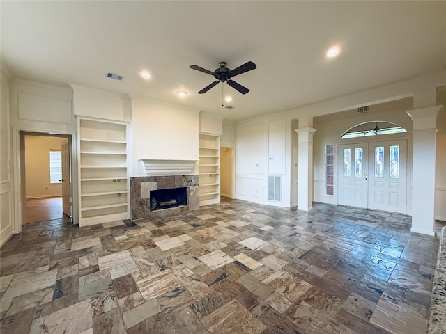 2147 Heather Green Dr, Houston, TX 77062 - unfurnished living room with ornate columns, ceiling fan, built in features, a fireplace, and recessed lighting
