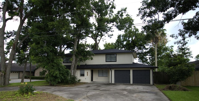 522 Oyster Creek Dr, Richwood, TX 77531 - traditional home featuring concrete driveway, an attached garage, and stucco siding