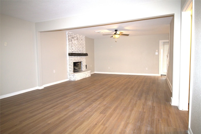 522 Oyster Creek Dr, Richwood, TX 77531 - unfurnished living room featuring a ceiling fan, dark wood finished floors, and a fireplace