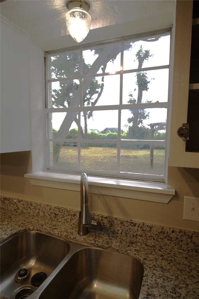 522 Oyster Creek Dr, Richwood, TX 77531 - kitchen view of a sink and light stone countertops