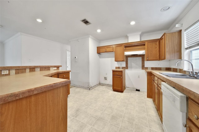 11307 Normeadow Ln, Houston, TX 77076 - kitchen with dishwasher, brown cabinets, ornamental molding, light floors, and light countertops