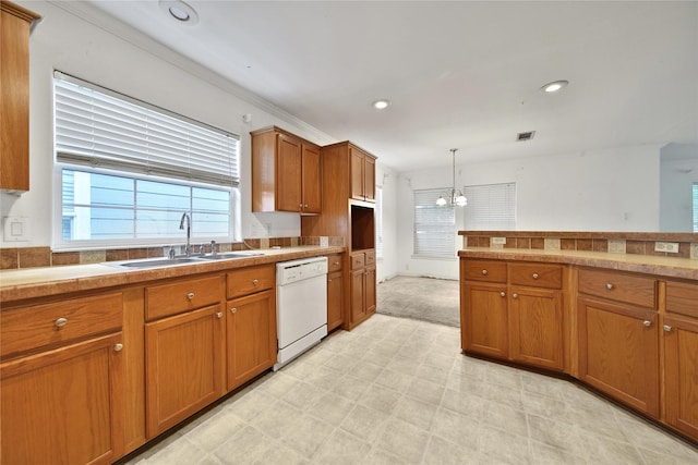 11307 Normeadow Ln, Houston, TX 77076 - kitchen with dishwasher, brown cabinets, a chandelier, decorative light fixtures, and light floors